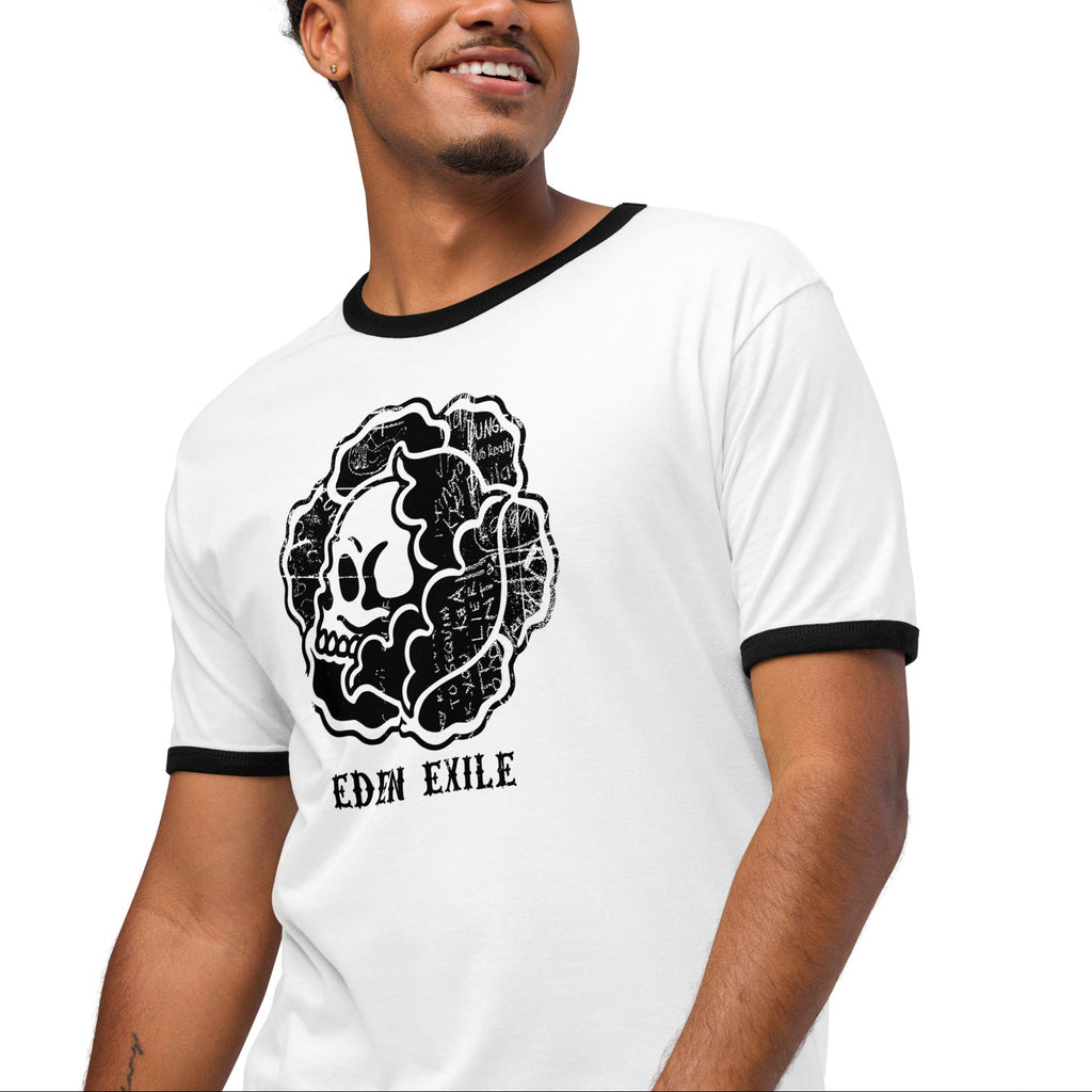 man wearing White ringer t shirt with front black print of a flower with a skull inside 