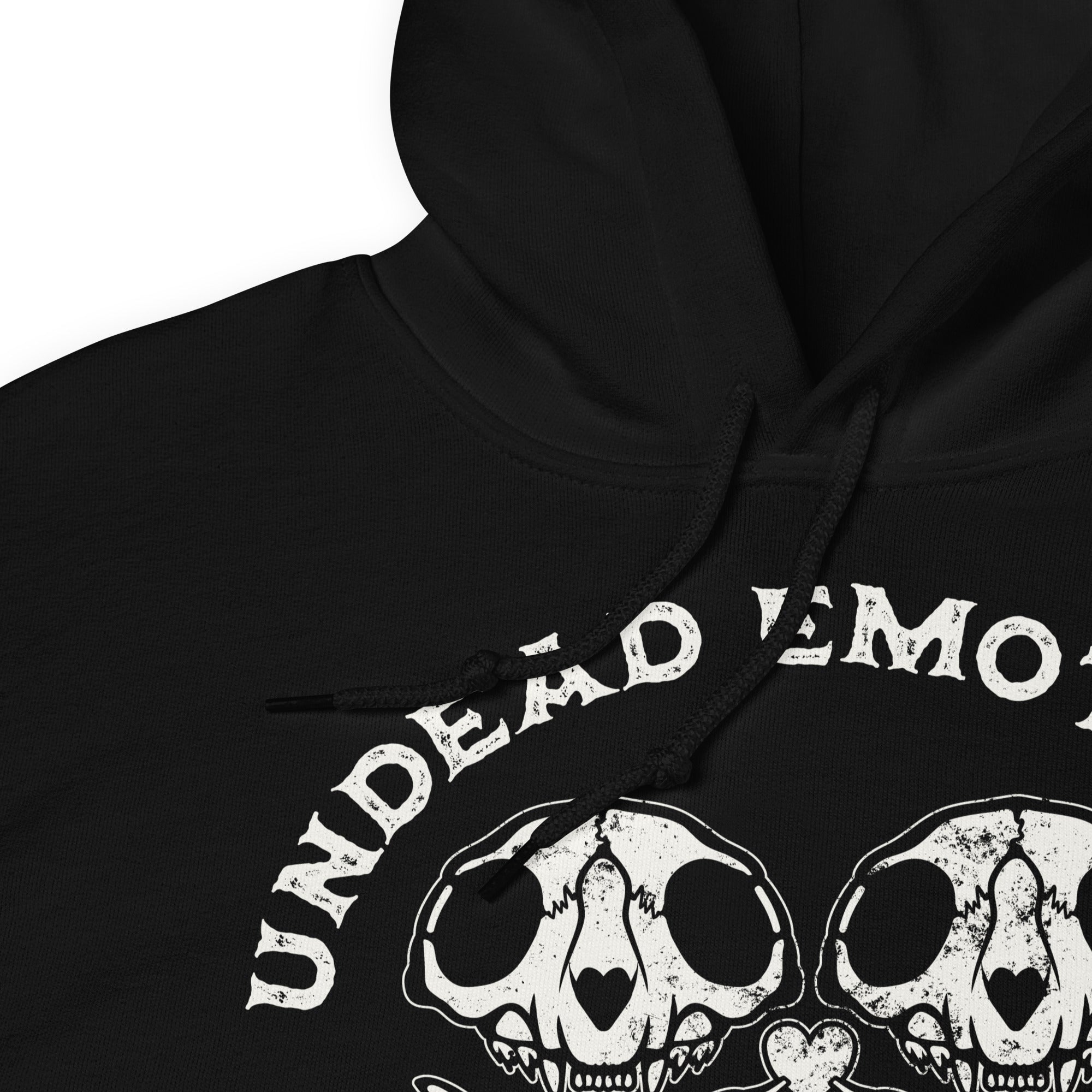 Black hoodie with 'Undead Emotions' text and heart made of skulls design on a white background