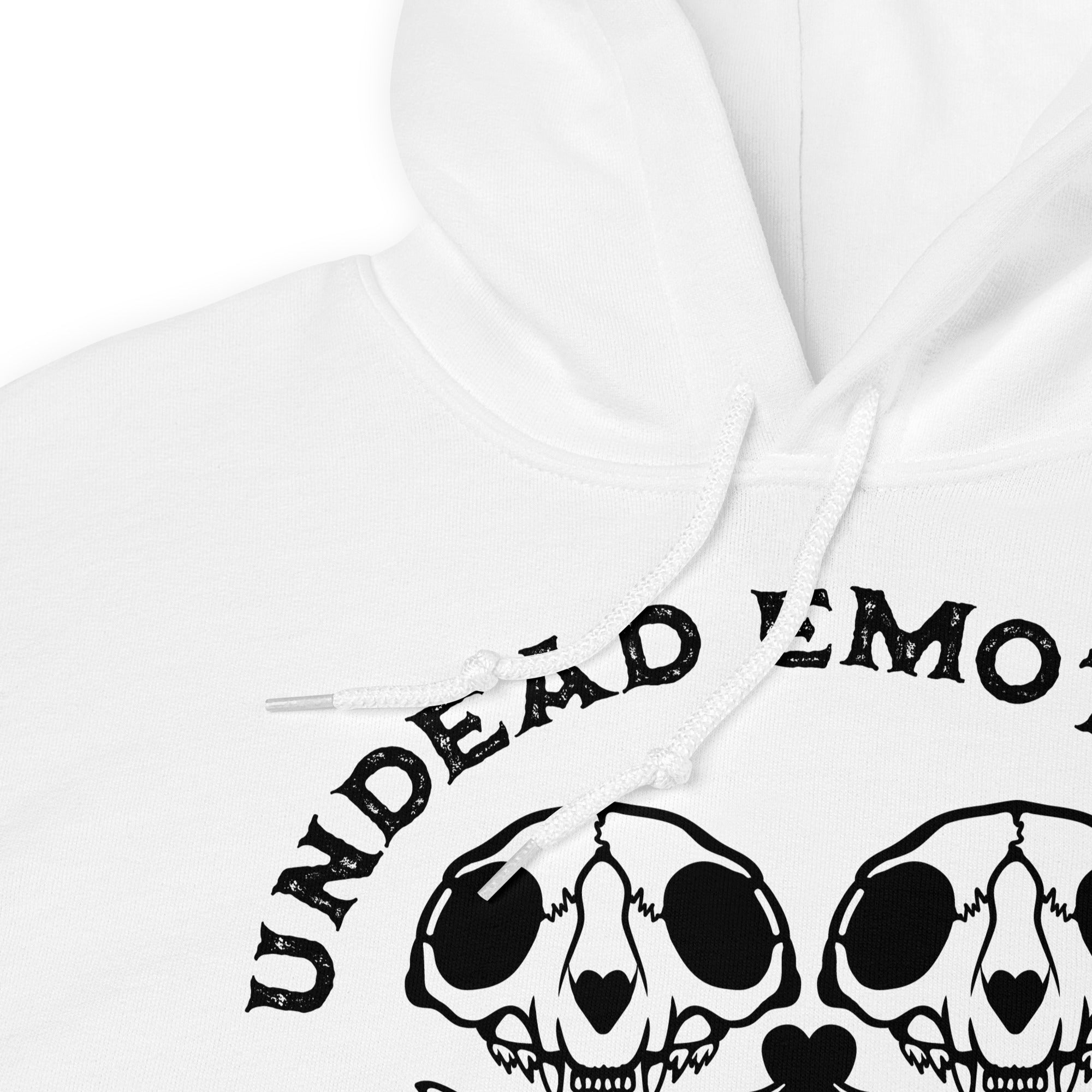 White hoodie with black 'UNDead EMOtions' text andheart of skulls design on a white background