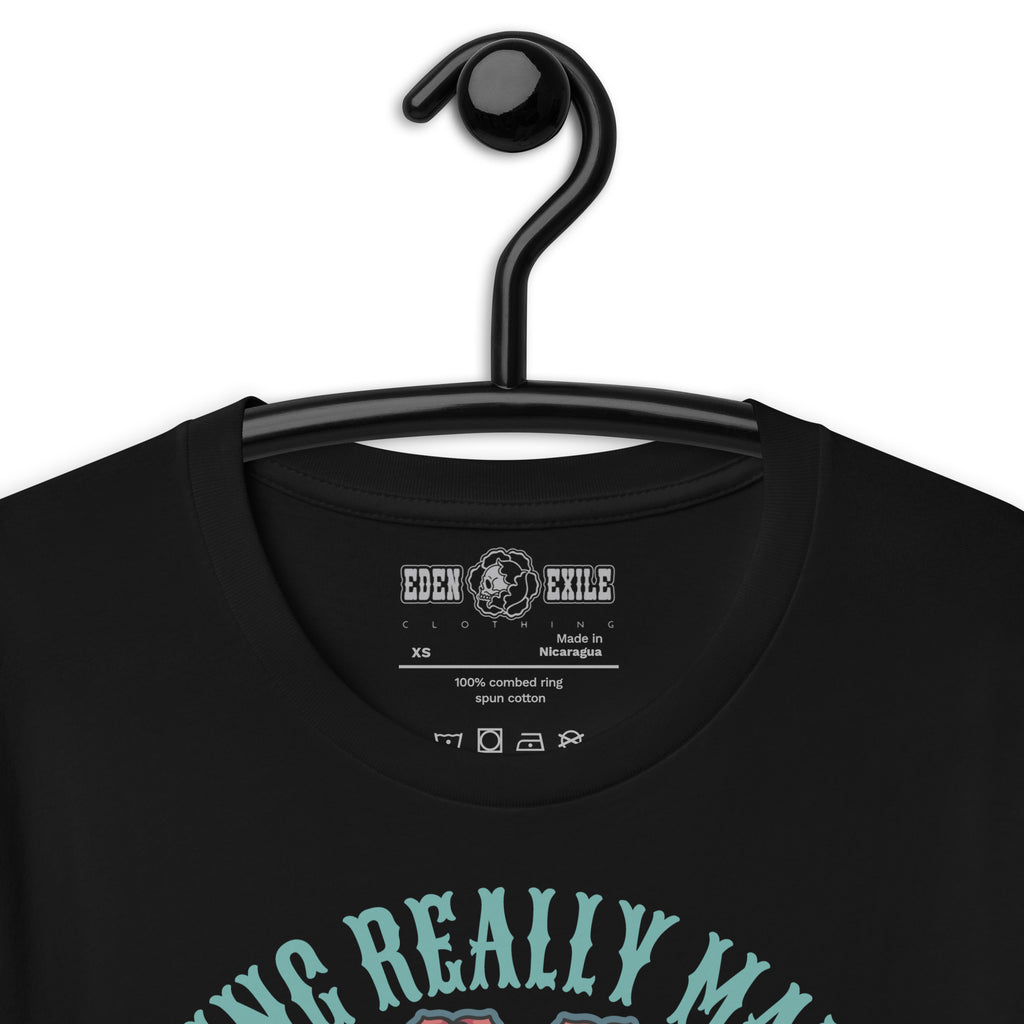 Black t-shirt with text and EDEN EXILE CLOTHING logo on a hanger against a white background