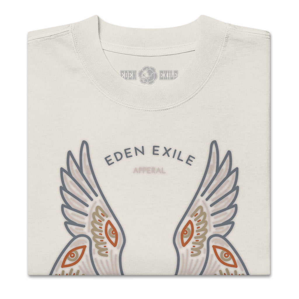 Folded t-shirt with 'Eden Exile' logo and wings of an angel design on a white background