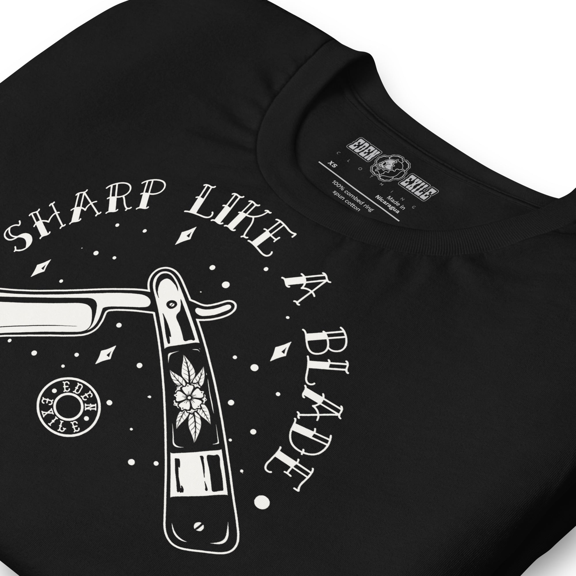 Black t-shirt with white vintage razor graphic design and text 'Sharp Like a Blade' on a white background