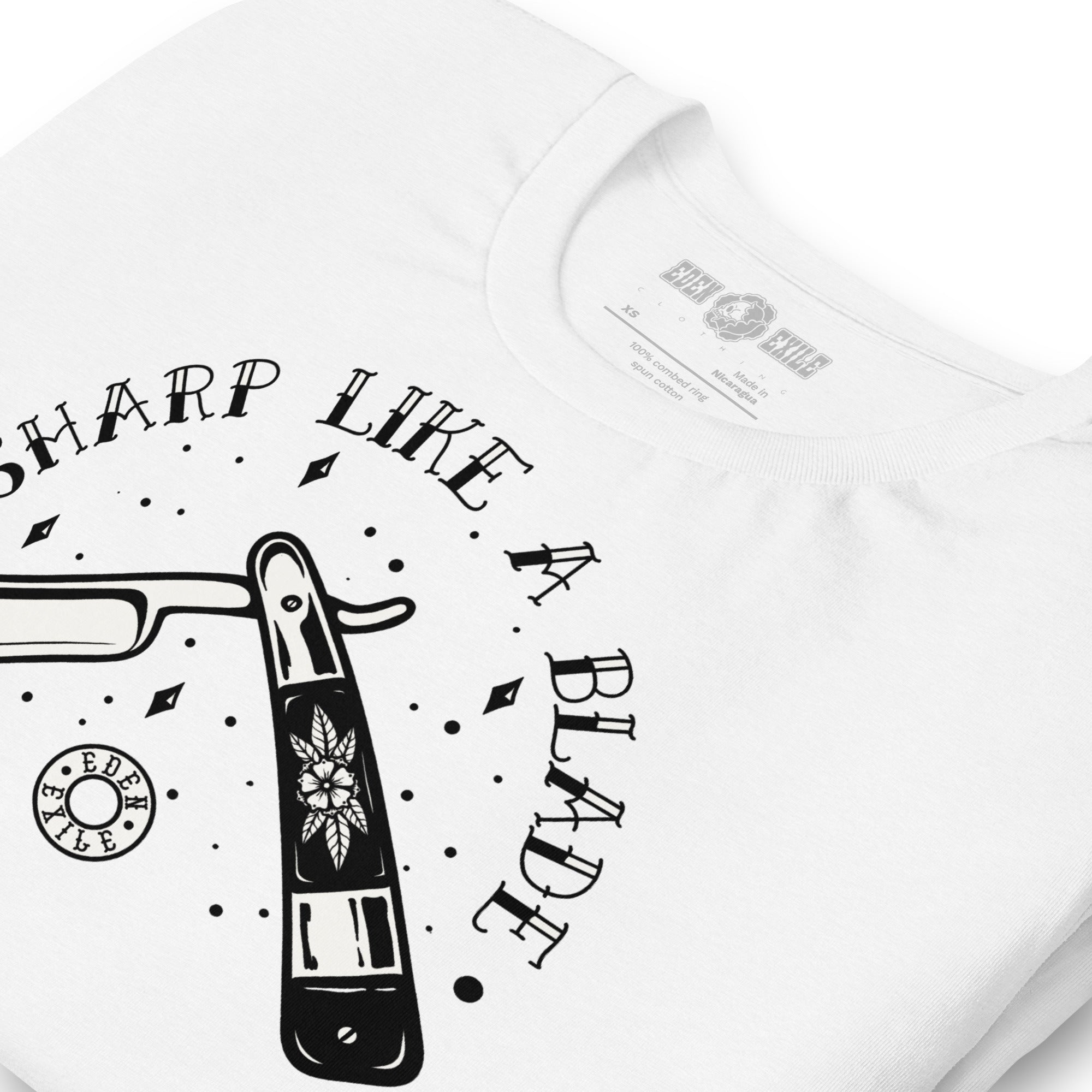 White t-shirt with white vintage razor tattoo graphic design and text 'Sharp Like a Blade'
