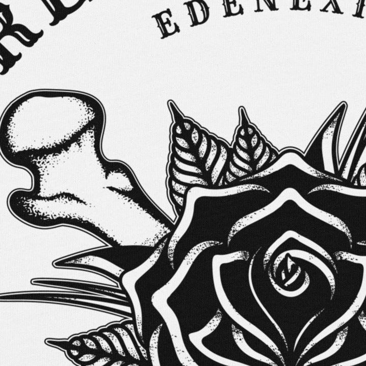 Black and white design with black rose and bones and 'Tread Lightly' text on a light gray background