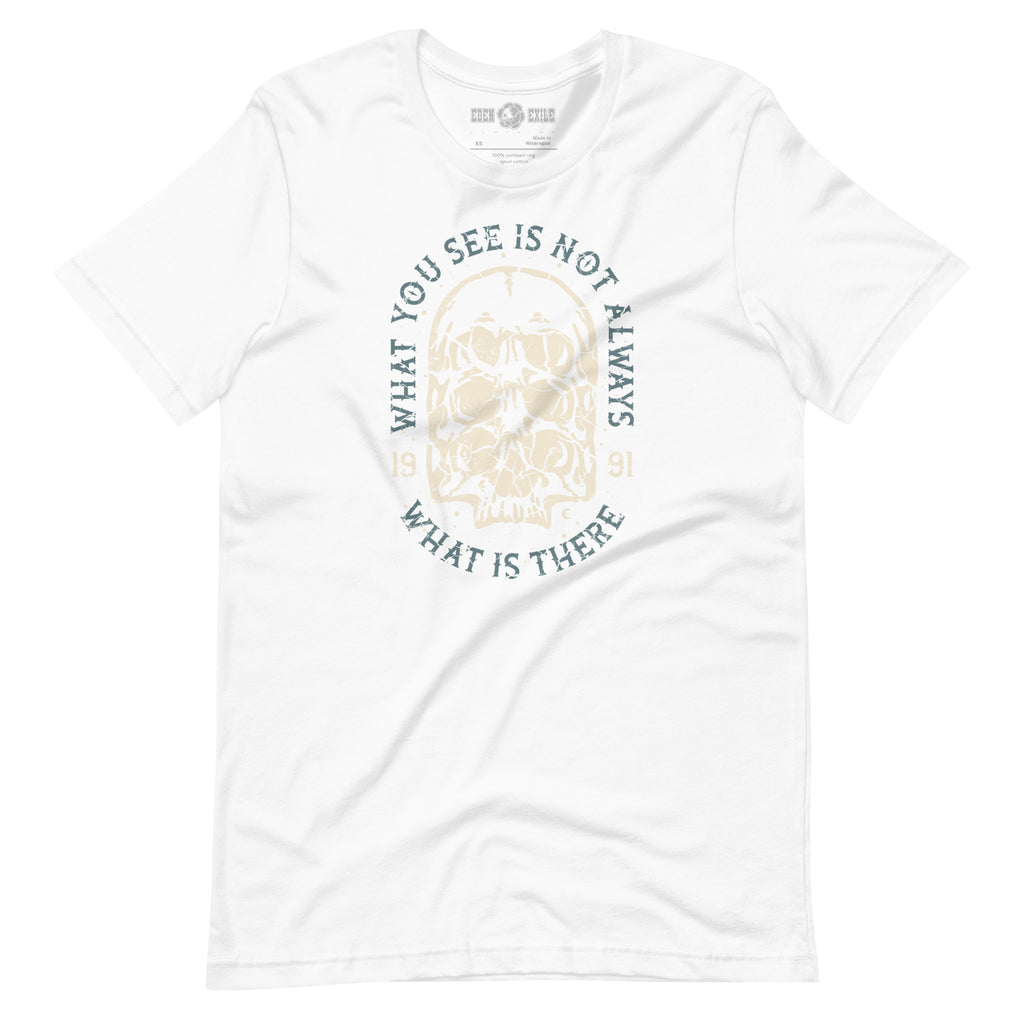 White t-shirt with a surreal skull design and text saying "what you see is not what is there"