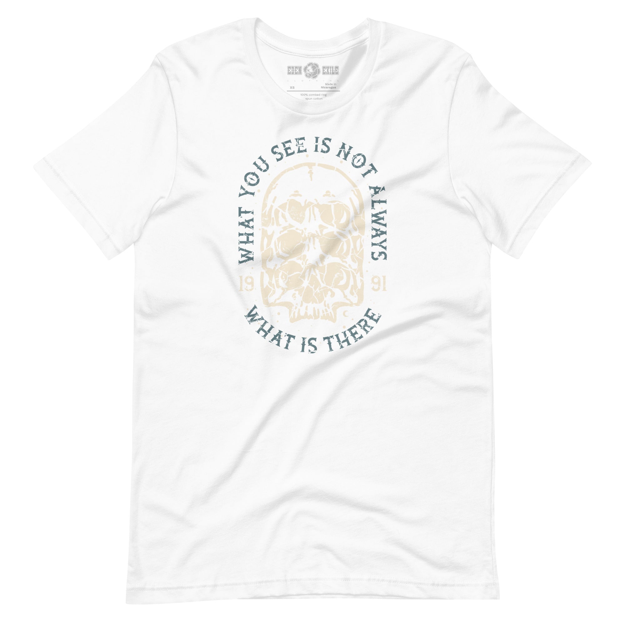 White t-shirt with a surreal skull design and text saying "what you see is not what is there"